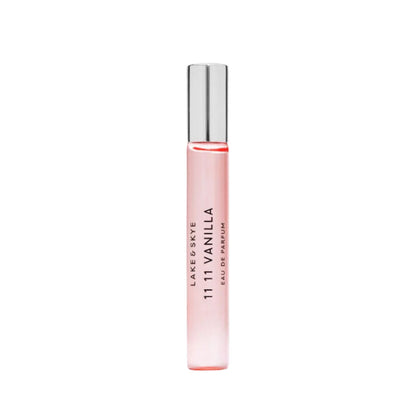 Pink perfume bottle with silver cap on a white background