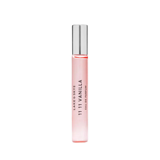 Pink perfume bottle with silver cap on a white background