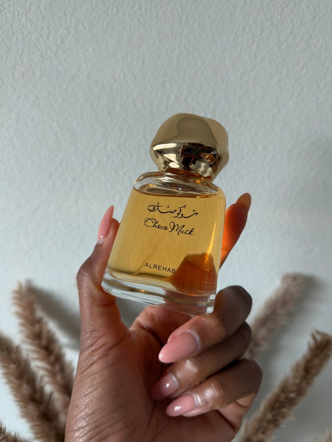 choco musk eau de parfum al rehab in a customer hand