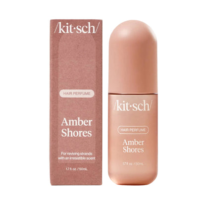 Kit-sch Amber Shores hair perfume bottle and packaging on a light gray background