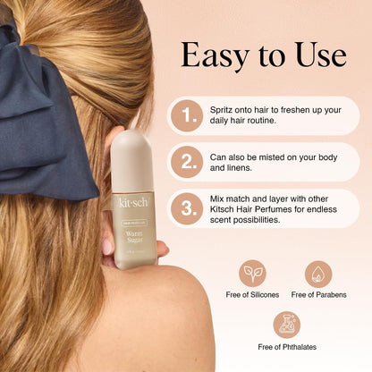 Woman holding a bottle of Kitsch hair perfume with usage instructions on a beige background