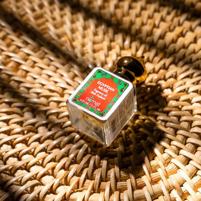 Nemat Egyptian Musk perfume oil on rattan in warm light